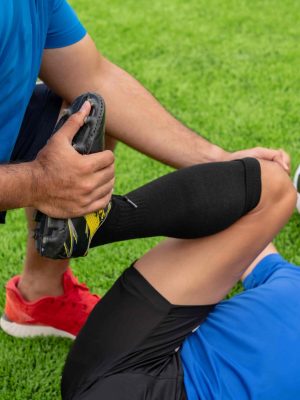 footballer-wearing-blue-shirt-black-pants-injured-lawn-during-racecompresssssss