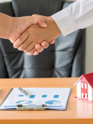 hands-agent-client-shaking-hands-after-signed-contract-buy-new-apartment