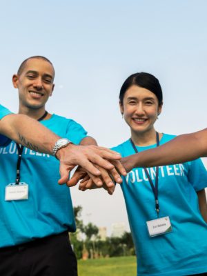 team-volunteers-stacking-hands